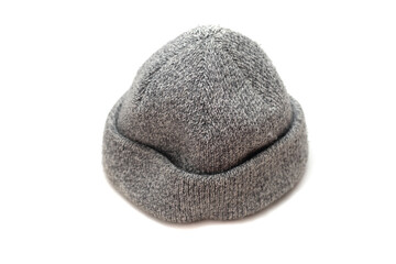 Fototapeta na wymiar knitted gray wool hat on a white background.