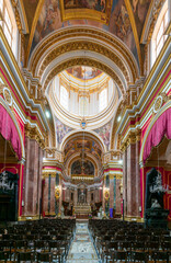 Fototapeta na wymiar view of the central nave and altar in the Metropolitan Cathedral of St. Paul in Mdina