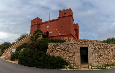 view of the landmark fortress and historic Saint Agatha's Tower in Malta under an overcast sky