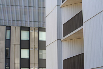 Abstract image of balconies of and windows on two apartment block styles
