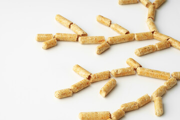 Wood pellets biofuel isolated on white background