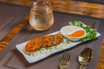 Fried Fish Cake with Dipping Sauce Thai style food. Edible Put the fish or shrimp mixed with chili paste to stick together until sticky in oil
