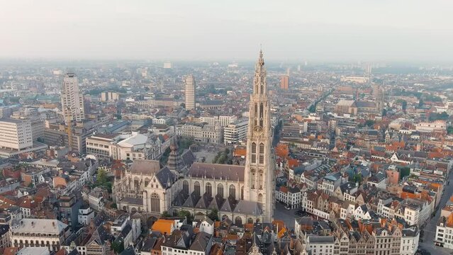 Antwerp, Belgium. Spire with the clock of the Cathedral of Our Lady (Antwerp). Historical center of Antwerp. City is located on river Scheldt (Escaut). Summer morning, Aerial View