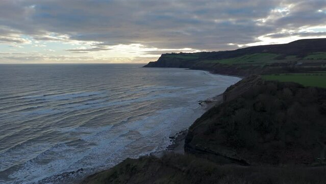 Establishing Drone Shot of North Yorkshire Coast Cliffs at Sunrise UK