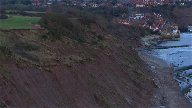 Aerial Drone Shot of Sedimentary Cliffs and Robin Hood's Bay Yorkshire