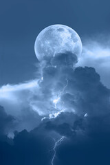 Lightning strikes between blue stormy clouds with full moon  