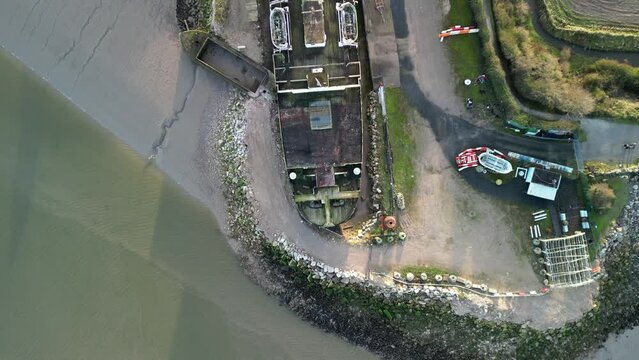 Ghost Ship the Duke of Lancaster at sunset - drone gimbal down pan from above - Mostyn, Wales, UK