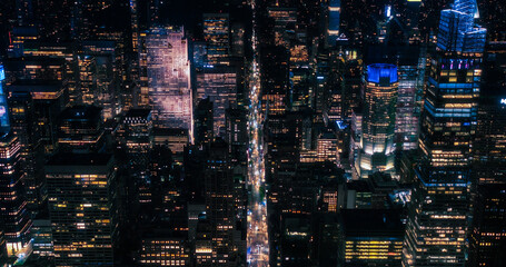 Cinematic Aerial Night Shots Capturing NYC Nightlife. Helicopter. Top Down View on City Streets...