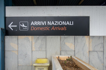 Palermo, Sicily, Italy A sign in Italian and English at the Palermo airport, or Falcone-Borsellino,...