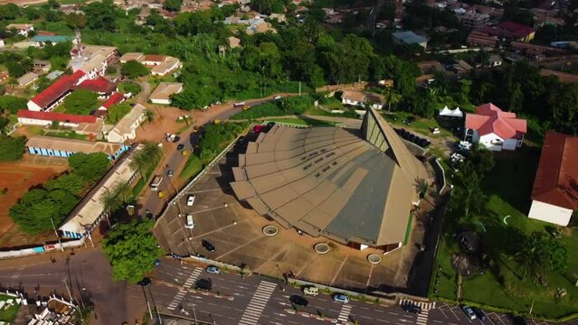 Aerial view rotating away from the Basilica of Mary Queen of Apostles, in sunny Cameroon