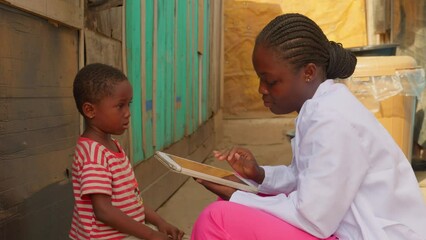 black African doctor nurse making diagnosis to young children kid in a clinic using tablet connected to 5g internet fast wifi connection data 
