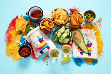 Cinco de mayo party food. Mexican holiday traditional dishes, snacks, tortilla corn chips, nachos, tacos, salsa, sauces.