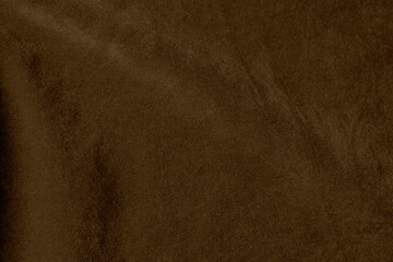 Brown color velvet fabric texture used as background. Empty brown fabric background of soft and smooth textile material. There is space for text.