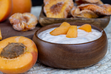 fresh cow's milk yogurt with peach slices, dairy yogurt