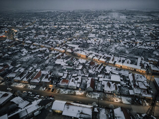 Frozen Elegance: A Drone's Eye View of Winter's Serenity Over Icy Lakes and Snow-laden Trees