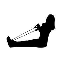 Silhouette of a sporty woman at gym workout using pull rope. Fitness exercise cords pull rope stretch resistance training.