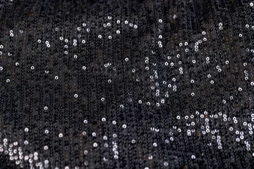 Foto op Plexiglas a large number of sequins on a black material © rsooll