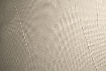 trowel and mortar strokes on the ceiling with wire mesh, abstract texture