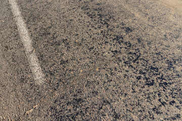 a part of an asphalt highway in close-up