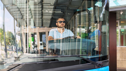 Male bus driver driving bus. Employment and labor day concept.  © Barillo Images