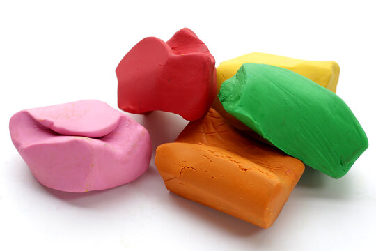 Colorful plasticine clay on white background.
