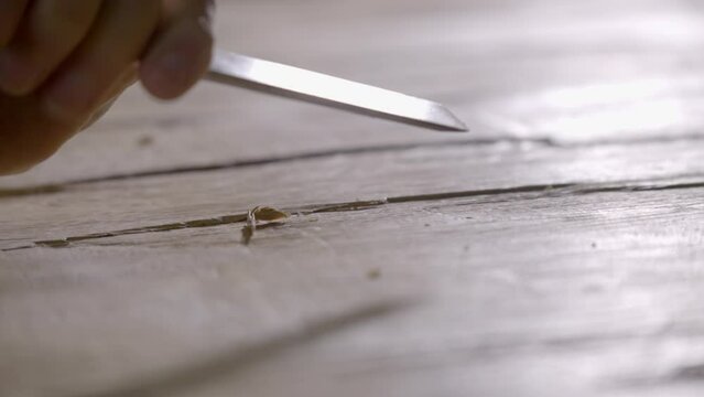 Carpenter sharp wood chisel carves grooves, joinery project CLOSE UP 