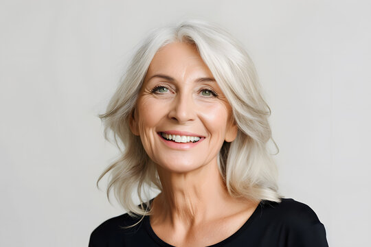 Mature old lady close up portrait. Senior model woman with grey hair laughing and smiling. Healthy face skin care beauty, skincare cosmetics, dental.
