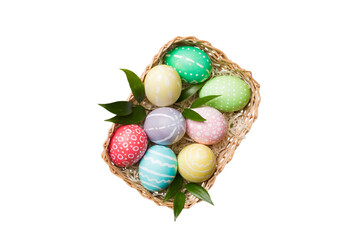 Basket of colorful Easter eggs isolated on white background. Easter basket filled with colored eggs...