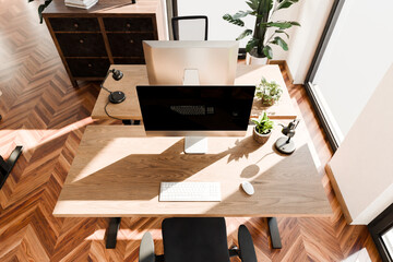 top down perspective of modern minimalistic pc workspace in luxurious loft office and panoramic view; remote work home office concept; bright daylight; 3D rendering