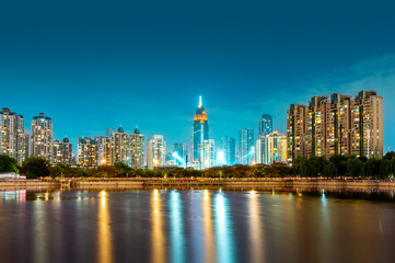Fototapeta na wymiar Skyscrapers by the lake, night view of Wuhan, China.