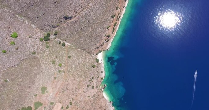 Orbiting drone shot of Agriosiko Beach, a secret travel destination located in Kefalonia, a part of the Ionian islands off the coast of Greece.