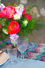 Table setting in vintage style is decorated with flowers