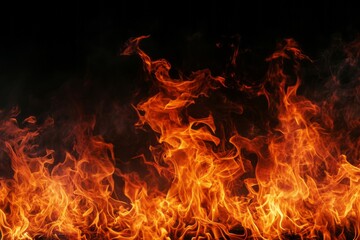 Fototapeta na wymiar A blazing fire burns against a black background