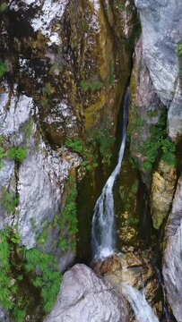Aerial drone view of the waterfall in Theth National Park, Albania. Nacerero of the river in the rock