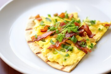 flatbread pizza with scrambled eggs, bacon, and chives