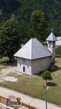 Aerial drone view over the Catholic Church in the valley of Theth national park, Albania. albanian alps