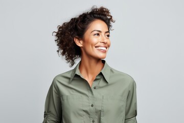 Portrait of happy smiling young african american woman in green shirt