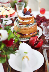 Obraz na płótnie Canvas Dessert table for a party. Cake, cupcakes, sweetness and flowers