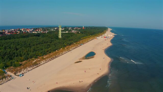 Aerial view of drone flying above the beach in Jastarnia, Poland at sunny summer day.