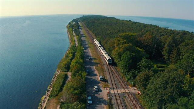Drone flying towards the train in the Hel penisula in Poland