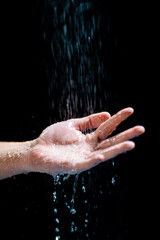 Fototapeta premium Closeup shot of a human's hand with water flowing onto it