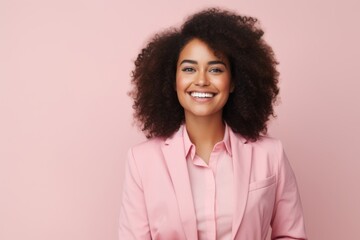 Portrait of smiling african american businesswoman in pink suit - Powered by Adobe