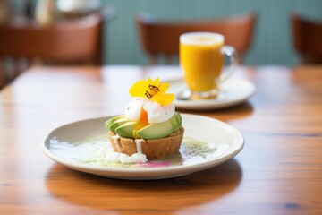 muffin with poached egg and avocado slices on top - obrazy, fototapety, plakaty