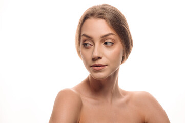 Fototapeta premium Beauty portrait of a blonde girl on a white isolated background. Skin care concept. Cosmetology. Tender skin