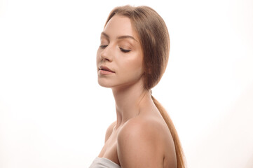 Beauty portrait of a blonde girl on a white isolated background. Skin care concept. Cosmetology. Tender skin