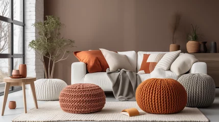 Fotobehang Scandinavian, hygge style home interior design of modern living room, Knitted pouf near white fabric sofa with blanket and terra cotta pillows, Ai generated image © PixxStudio