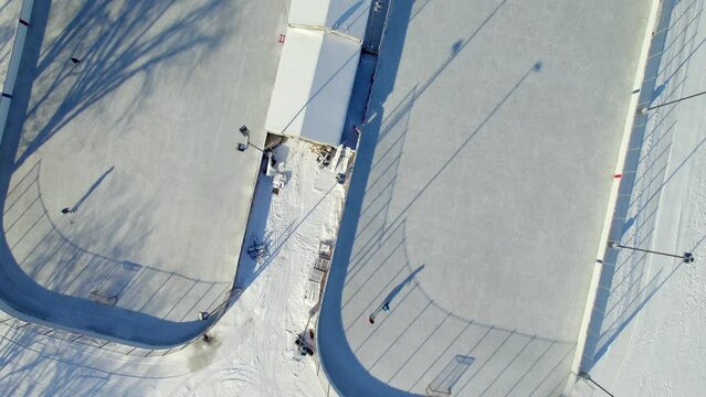 Overhead aerial of outdoor hockey rinks in Canada, 4K