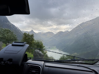 View from inside a motorhome camper on a rainy day in the Geiranger fiord, Norway.