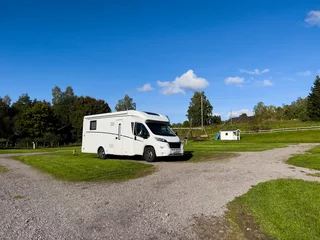 Foto op Plexiglas Motorhome camper in a campsite near Oslo, south Norway. Europe © Alberto Gonzalez 