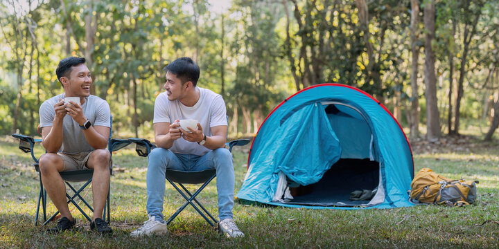Male gay couple asian traveling with tent camping outdoor and various adventure lifestyle hiking active summer vacation